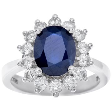 14k white gold ring with approx 3 cts oval dark blue sapphire and approx 0.80 cts in accent diamonds. Size 7.