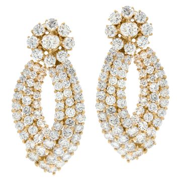 Dangling diamond earrings set in 18K yellow gold with over 15 carats round brilliant cut diamonds.