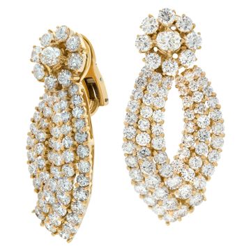 Dangling diamond earrings set in 18K yellow gold with over 15 carats round brilliant cut diamonds.