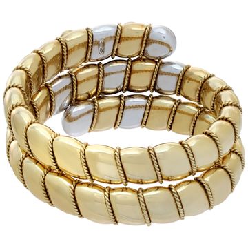 Egyptian revival, flexible diamonds "Serpenti" bracelet with cabochon rubies, sapphires and emeralds, in 18K white & yellow gold. Round brilliant cut diamonds total approx. weight: 4.25 carats.