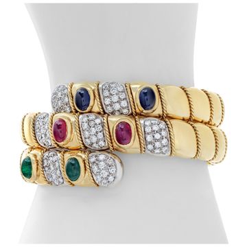 Egyptian revival, flexible diamonds "Serpenti" bracelet with cabochon rubies, sapphires and emeralds, in 18K white & yellow gold. Round brilliant cut diamonds total approx. weight: 4.25 carats.