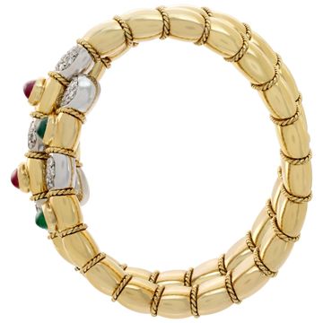 Egyptian revival, flexible diamonds "Serpenti" bracelet with cabochon rubies, sapphires and emeralds, in 18K white & yellow gold. Round brilliant cut diamonds total approx. weight: 4.25 carats.