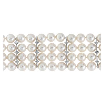 Four strand pearl bracelet with 18k white gold and diamond clasp and stations. 7.5mm pearls