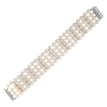 Four strand pearl bracelet with 18k white gold and diamond clasp and stations. 7.5mm pearls