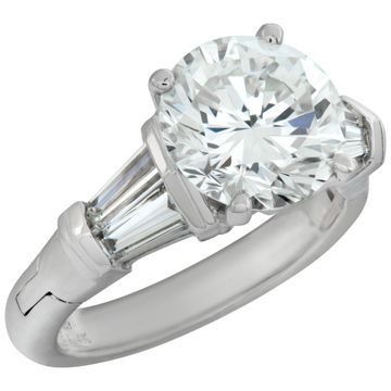 GIA Certified round brilliant cut 3.09 carat diamond, H Color, VS2 clarity set on a "FINGER MATE" platinum & 14K white gold setting with 4 tapered baguettes