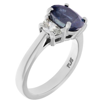 Gorgeous Sapphire and Diamonds ring set in Platinum. Central oval cut deep blue sapphire, approx total weight: 2 carats,
