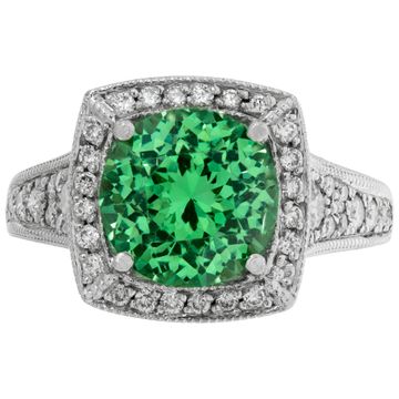 Green garnet ring in platinum with accent round brilliant cut diamonds