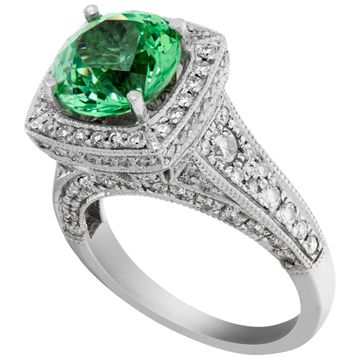 Green garnet ring in platinum with accent round brilliant cut diamonds
