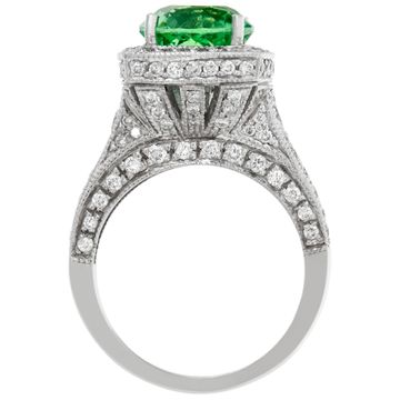 Green garnet ring in platinum with accent round brilliant cut diamonds