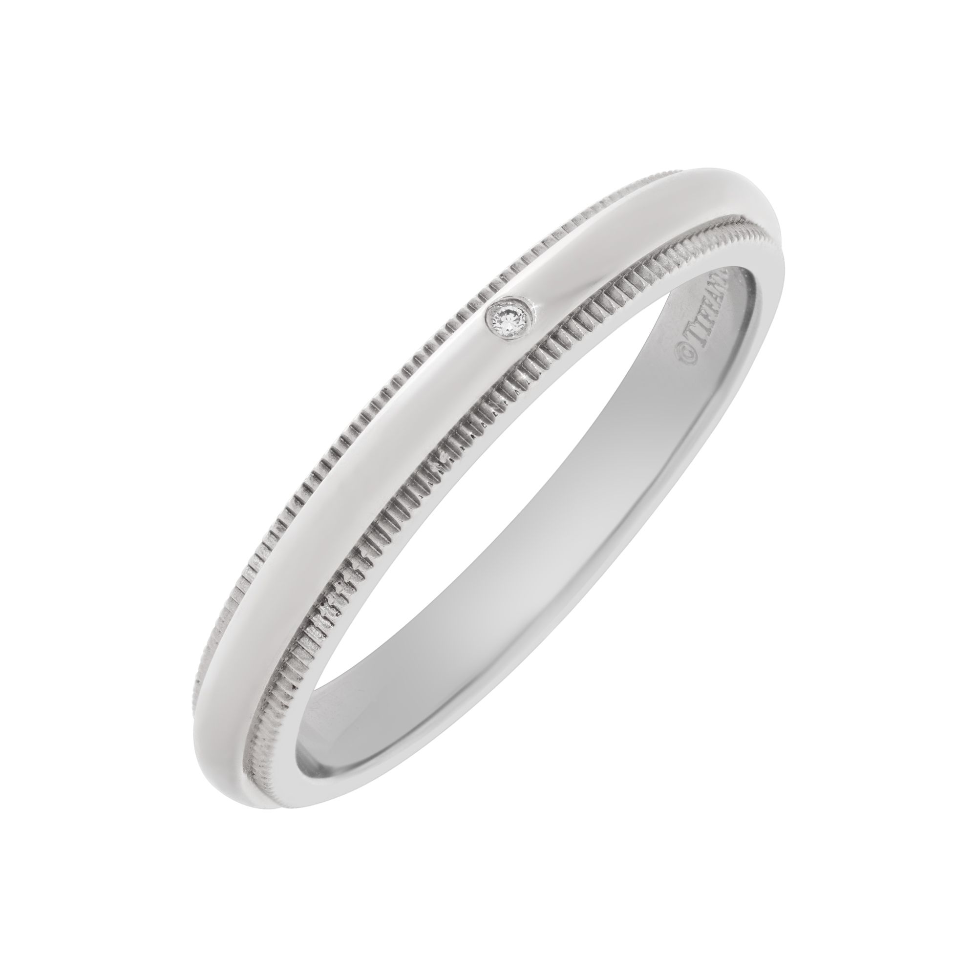 Tiffany & Co. Milgrain wedding band in platinum with single diamond accent