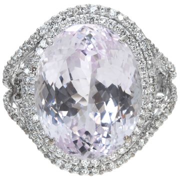 Oval brilliant cut Kunzite (31.39 carats) and diamonds (1.55.carat) ring in 18k white gold