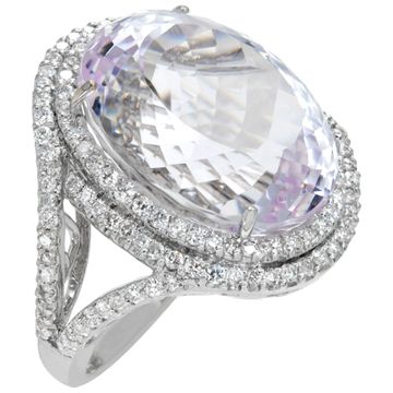 Oval brilliant cut Kunzite (31.39 carats) and diamonds (1.55.carat) ring in 18k white gold