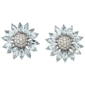 Signed "Asprey" London, Daisy Heritage collection, brilliant cut blue topaz and diamonds necklace and earrings parure, set  in 18k white gold.