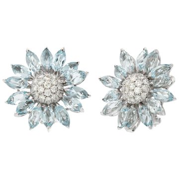 Signed "Asprey" London, Daisy Heritage collection, brilliant cut blue topaz and diamonds necklace and earrings parure, set  in 18k white gold.