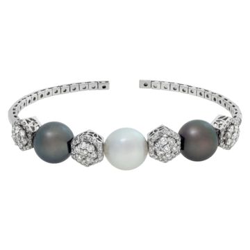 South Sea (white),Tahitian (gray) pearls and diamonds cuff/bangle in 18k. Pearls are 11 x 11.5mm. Round brilliant cut diamonds total approximate weight: 1.31 carat