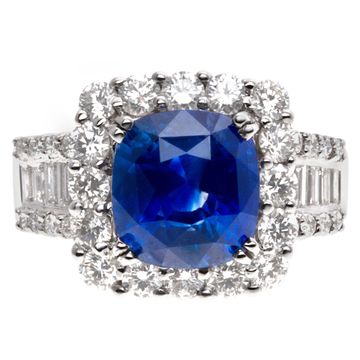 Sparkling 5.73 carat blue sapphire ring with diamond accents in 18k white gold