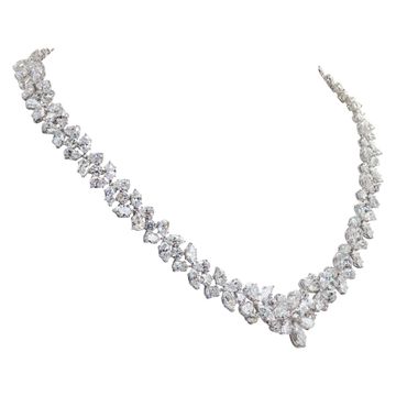 Stunning diamond necklace in 18k white gold. Floral mosaic of Marquise, Pear and Round Brilliant cut Diamonds, total approx. weight: 50.00 carats 17.00 inches long.