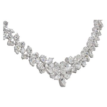 Stunning diamond necklace in 18k white gold. Floral mosaic of Marquise, Pear and Round Brilliant cut Diamonds, total approx. weight: 50.00 carats 17.00 inches long.