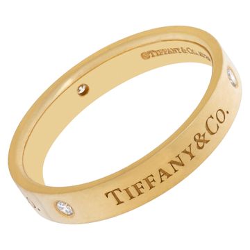 Tiffany & Co. 18k gold band ring with three round brilliant diamonds