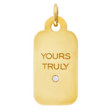 Tiffany & Co. "Yours Truly", 18Kt yellow gold Charm/Pendant with one center diamond.