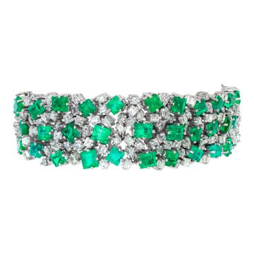 Vintage diamond and emerald platinum bracelet with over 17 carats in diamonds (H, VS) and 32 carats in Columbian emeralds. Length: 7 inches. Width tapers from 0.75 to 0.50 inches