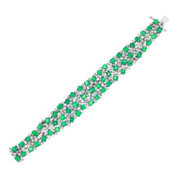 Vintage diamond and emerald platinum bracelet with over 17 carats in diamonds (H, VS) and 32 carats in Columbian emeralds. Length: 7 inches. Width tapers from 0.75 to 0.50 inches