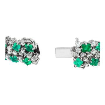Vintage diamond and emerald platinum bracelet with over 17 carats in diamonds (H, VS) and 32 carats in Columbian emeralds. Length: 7 inches. Width tapers from 0.75 to 0.50 inches