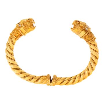 Vintage Greek designer Ilias Lalaouinis for Zolotas, original double Chimera heads design bangle bracelet in 18K yellow gold. Bangle will fit up to 6.50 inches wrist.