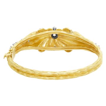 Vintage hinged diamonds bangle bracelet in bark finished 18k yellow gold. Round & baguettes cut diamonds total approx.weight: 1.50 carat