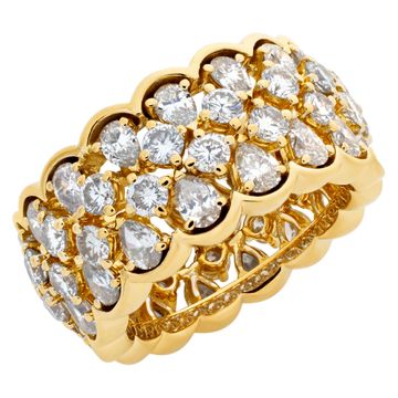 Wide "Eternity"band with approximately 5 carats full cut round brilliant & pear shape diamonds, set in 18K yellow gold