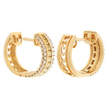 Yellow and white diamond huggie earrings in 18k yellow gold